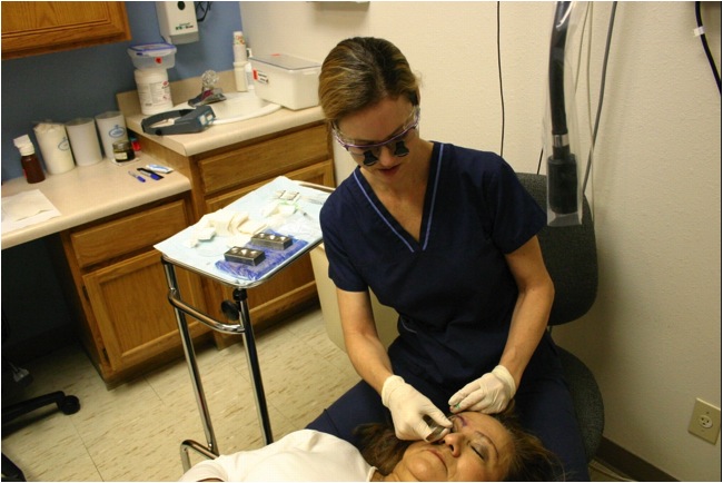 Dr. Krejci performing an eyebrow transplant on a patient